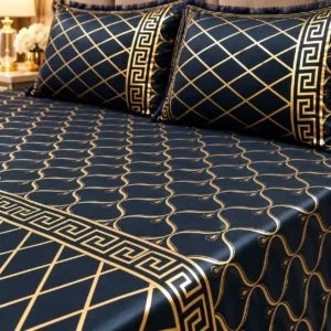 close up of the midnight gold velvet bed sheet fabric and gold print