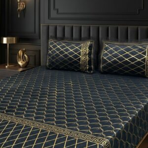 close up of the black velvet bedsheet fabric and gold print