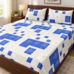 Blue Mosaic Pure Cotton Bed Sheet with two pillow covers on a dark walnut wooden bed with a panel headboard