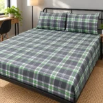 Grey Green Check Pure Cotton Bed Sheet with two pillow covers on a slim black metal frame bed