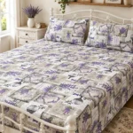 Lavender Provence Pure Cotton Bed Sheet with two pillow covers on a white wrought iron bed in a cottage-style bedroom