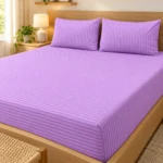 Lavender Stripe Pure Cotton Bed Sheet with two pillow covers on a light oak platform bed with a floating headboard