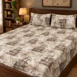 Vintage Voyage Pure Cotton Bed Sheet with two pillow covers on a dark stained wooden bed beside a bookshelf