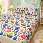 White Meadow Bloom 3D Bedsheet with two pillow covers on a white bed with a rounded headboard in a children's room