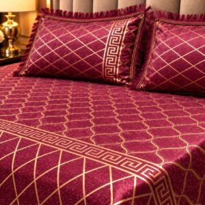 close up of the burgundy gold velvet bed sheet fabric and gold print